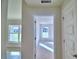 Bright hallway leads to sunlit rooms, enhancing the home's airy feel at 4062 Tullamore Ln, Auburndale, FL 33823