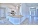 Open kitchen features granite countertops, stainless steel appliances, and a breakfast bar for casual dining at 4062 Tullamore Ln, Auburndale, FL 33823