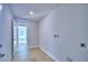 Functional laundry room with tile flooring and utility connections at 4062 Tullamore Ln, Auburndale, FL 33823
