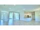 A bright and airy living room featuring tile flooring, white walls, and an open layout at 4066 Tullamore Ln, Auburndale, FL 33823
