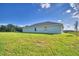 Exterior of the home with expansive yard, a tranquil view of the conservation area at 4123 Tullamore Ln, Auburndale, FL 33823