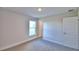 This bedroom has carpet, natural light from the window, and neutral painted walls at 4123 Tullamore Ln, Auburndale, FL 33823