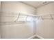 A walk-in closet with white walls and wire shelving for efficient storage at 4123 Tullamore Ln, Auburndale, FL 33823