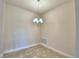 This dining area features tiled floors and a modern light fixture at 4123 Tullamore Ln, Auburndale, FL 33823