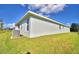 Exterior view of the home with a well-maintained lawn and clean architectural lines at 4123 Tullamore Ln, Auburndale, FL 33823