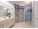 Bathroom showcasing a vanity with double sinks and a step-in shower at 4315 Larrys Lagoon, Winter Haven, FL 33884