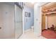 Bright blue bathroom with a glass-enclosed shower and walk-in closet at 4315 Larrys Lagoon, Winter Haven, FL 33884