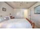 Comfortable bedroom features a large closet and soft, patterned wallpaper at 4315 Larrys Lagoon, Winter Haven, FL 33884