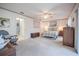 Spacious bedroom with plush carpeting, ceiling fan, and ensuite bathroom access at 4315 Larrys Lagoon, Winter Haven, FL 33884