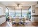 Sunlit dining nook with large windows offering natural light and views of the surrounding greenery at 4315 Larrys Lagoon, Winter Haven, FL 33884
