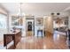 Open-concept dining area with hardwood floors, chandelier, and flow into the adjacent rooms at 4315 Larrys Lagoon, Winter Haven, FL 33884