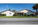 Rear exterior of home featuring an enclosed patio area and well-maintained landscaping at 4315 Larrys Lagoon, Winter Haven, FL 33884