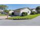 Home exterior featuring a manicured lawn and a brick-paved driveway leading to the garage at 4315 Larrys Lagoon, Winter Haven, FL 33884