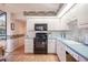 Charming kitchen with white cabinets, a black oven, and modern faucet providing functionality and style at 4315 Larrys Lagoon, Winter Haven, FL 33884