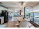 Open-concept kitchen with white cabinets, black appliances, and bright dining nook with views at 4315 Larrys Lagoon, Winter Haven, FL 33884