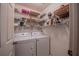 Bright laundry room featuring a washer, dryer, and ample shelving for storage at 4315 Larrys Lagoon, Winter Haven, FL 33884