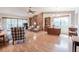 Spacious living room with wood floors, brick wall, and sliding glass doors to the patio at 4315 Larrys Lagoon, Winter Haven, FL 33884