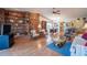 Inviting living area with a brick fireplace, comfortable seating, and an open layout to dining at 4315 Larrys Lagoon, Winter Haven, FL 33884