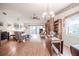Bright living room featuring wood floors and a decorative brick accent wall at 4315 Larrys Lagoon, Winter Haven, FL 33884
