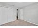 Bedroom with closet, neutral walls and carpet, and a door leading to another room at 4424 Reding Way, Lakeland, FL 33813