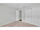 Bedroom with closet, neutral walls and carpet, and a door leading to another room at 4424 Reding Way, Lakeland, FL 33813