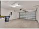 A spacious two car garage with neutral walls and concrete floors at 4424 Reding Way, Lakeland, FL 33813