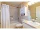 Bright bathroom featuring a shower/tub, cabinet storage, vanity and decorative touches at 4427 Whistlewood Cir, Lakeland, FL 33811