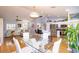 Open floor plan featuring kitchen, living, and dining areas with hardwood floors throughout at 4427 Whistlewood Cir, Lakeland, FL 33811