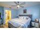 This serene main bedroom features a comfortable bed, nightstands, and an ensuite bathroom for added privacy at 4427 Whistlewood Cir, Lakeland, FL 33811