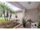 Covered front porch with a seating area and views of the landscaped yard at 4427 Whistlewood Cir, Lakeland, FL 33811