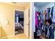 Walk-in closet organized with clothing, shelving, and plenty of room to organize, with access to the main bedroom at 4427 Whistlewood Cir, Lakeland, FL 33811