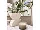 Close-up of stylish bathroom decor, featuring a decorative vase, candle, and marble countertops at 4641 Devon Ave, Lakeland, FL 33813