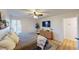 Inviting bedroom with a ceiling fan, TV, dresser, and light wood floors at 4641 Devon Ave, Lakeland, FL 33813
