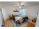 Cozy bedroom featuring natural light, neutral tones, and stylish furnishings at 4641 Devon Ave, Lakeland, FL 33813