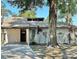 Charming single-story home with a well-maintained front yard and mature trees at 4641 Devon Ave, Lakeland, FL 33813