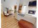 Bright living room with stone fireplace, modern décor, and hardwood floors at 4641 Devon Ave, Lakeland, FL 33813