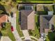 From above, admire this home's layout with its spacious yard, screened-in pool, and private driveway at 474 Cedar Glen Dr, Lake Alfred, FL 33850