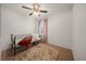 Bright bedroom with neutral carpet, a daybed, and a window adorned with light pink curtains at 474 Cedar Glen Dr, Lake Alfred, FL 33850