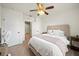 Cozy bedroom features neutral tones, carpeted floors, and ceiling fan for added comfort at 474 Cedar Glen Dr, Lake Alfred, FL 33850