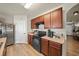Kitchen shows ample cabinet space, modern appliances, and light-colored flooring at 474 Cedar Glen Dr, Lake Alfred, FL 33850