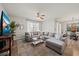 Inviting living room with a large sectional sofa, plush rug, and natural light at 474 Cedar Glen Dr, Lake Alfred, FL 33850
