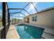 Sparkling pool features a screened enclosure, offering a refreshing escape with style and protection at 474 Cedar Glen Dr, Lake Alfred, FL 33850