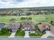 Ariel view of a golf course community showcasing the beautiful property and surrounding green landscape at 565 Osprey Landing Dr, Lakeland, FL 33813