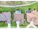 An aerial view of a home and pool in a golf community with lush green landscaping and beautiful surroundings at 565 Osprey Landing Dr, Lakeland, FL 33813