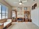 Bedroom featuring a large window, display cases, and day bed creates a peaceful and inviting retreat at 565 Osprey Landing Dr, Lakeland, FL 33813