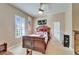 Bedroom with a ceiling fan, large bed, neutral walls, and Asian-themed decor create a relaxing atmosphere at 565 Osprey Landing Dr, Lakeland, FL 33813