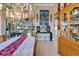 Well appointed dining room with chandelier, and open access to the living area and kitchen at 565 Osprey Landing Dr, Lakeland, FL 33813