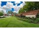 Landscaped entrance to the Eaglebrooke community with brick signage and lush green lawn at 565 Osprey Landing Dr, Lakeland, FL 33813