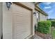 Attached garage with a clean, neutral exterior and well-maintained landscaping, offering convenience at 565 Osprey Landing Dr, Lakeland, FL 33813