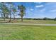 Scenic view of the lush green golf course, showcasing the property's desirable location at 565 Osprey Landing Dr, Lakeland, FL 33813